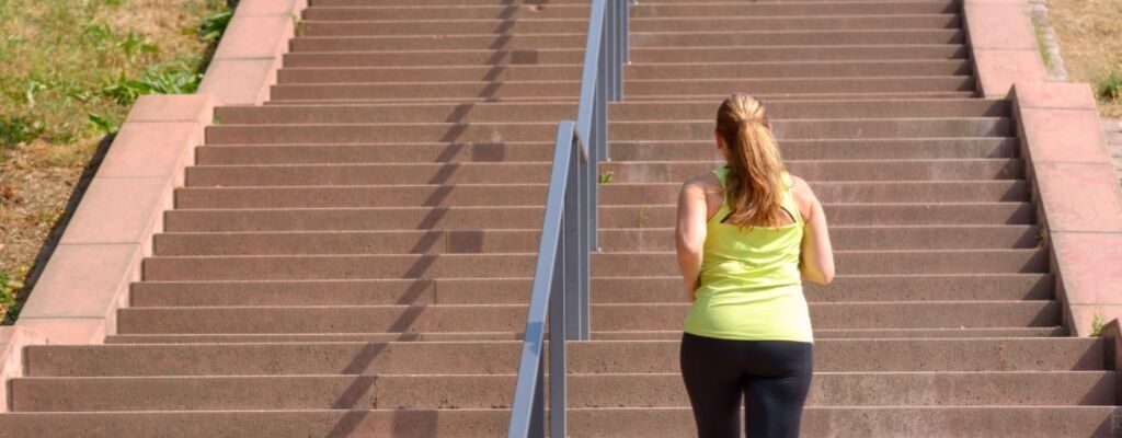 a lady climbing stairs
